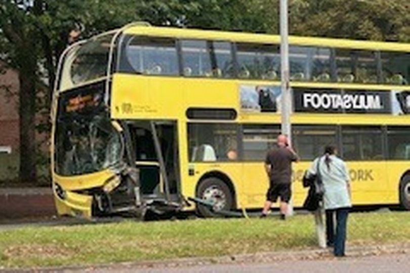 Scene of bus crash after double-decker is smashed into pole