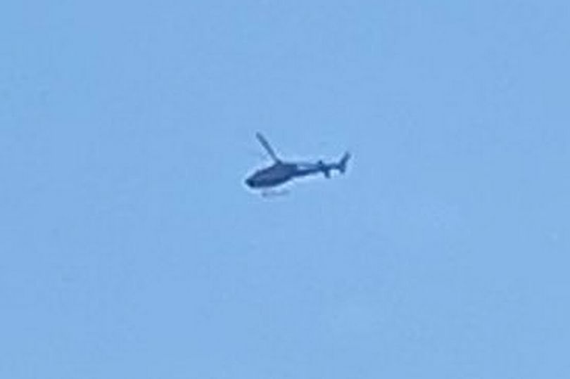 Helicopter filmed mysteriously circling over Manchester city centre