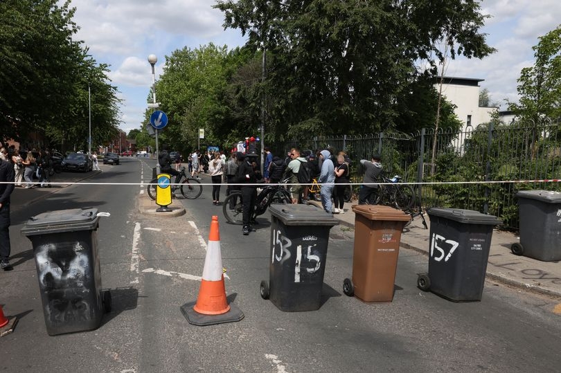 Road blocked as family and friends pay tribute to two teenagers killed in motorbike crash