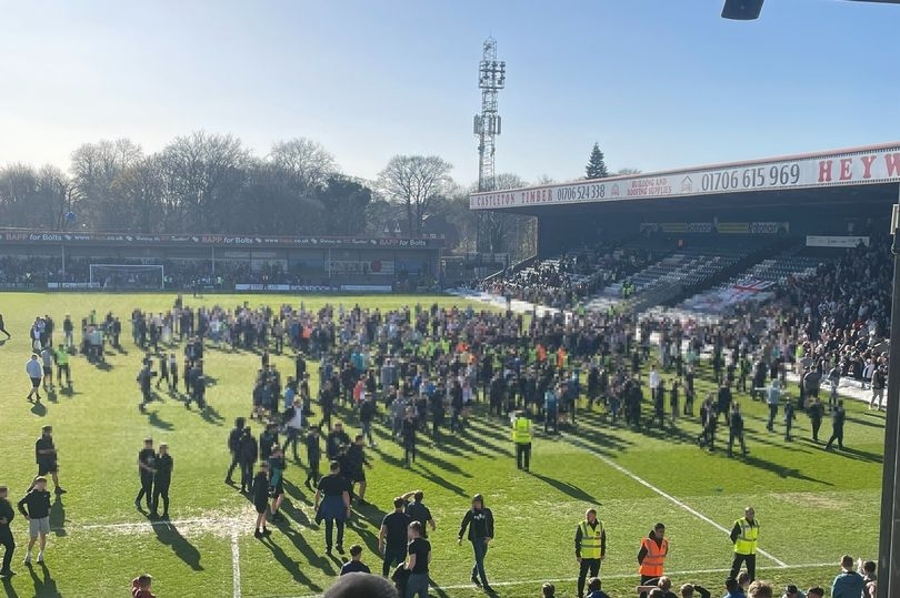 Chaos erupts on pitch after Rochdale AFC game as parents 'cover children's eyes'