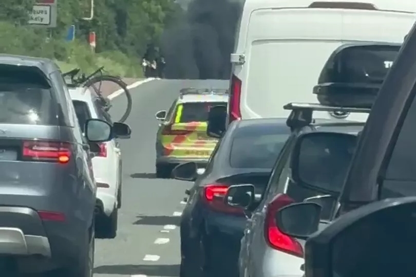 Traffic stopped on M6 as vehicle goes up in flames