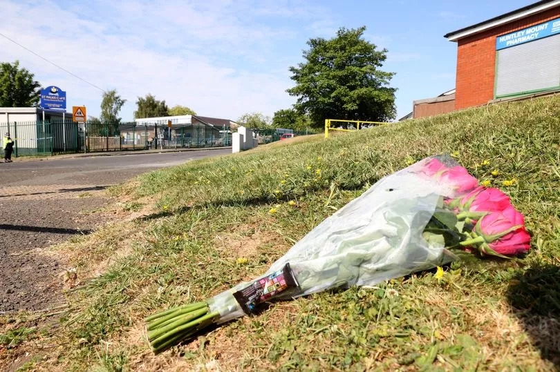 Flowers left in the street after 19-year-old killed