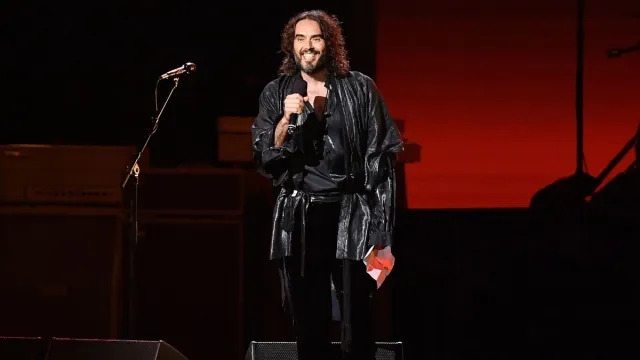 Russell Brand Doesn't Let Rape Allegations Interrupt Vacation Time