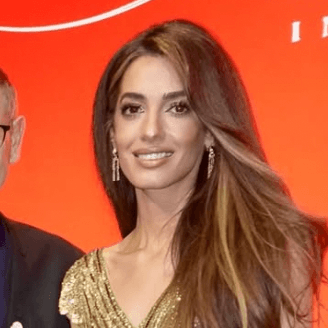 Amal Clooney Dresses Like a Walking Cartier Love Bracelet at a Luxury Gala