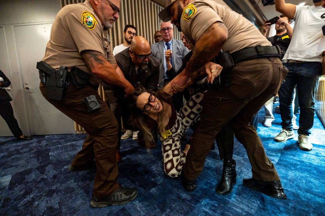 In chaotic, shameful scene, Miami-Dade commissioners watch public speaker dragged out