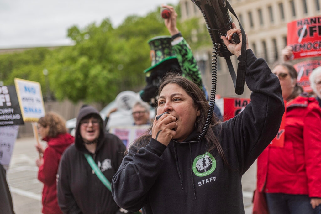 Protesters gather outside Rep. Barrett's Lansing office after vote to approve federal budget bill