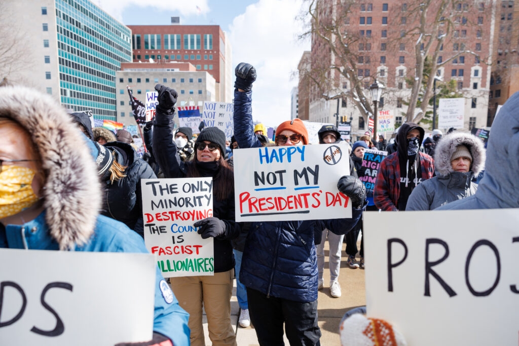 Despite below freezing temps, protestors rally against Trump, urge Democrats to take action