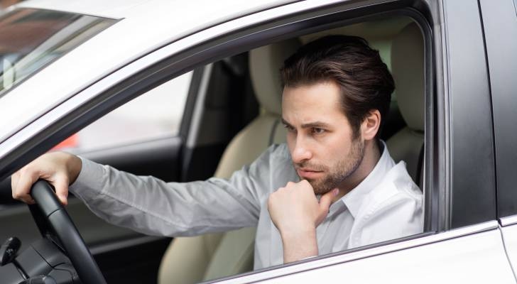 I'm 26 and recently came into $50K. I've got a $27K car loan — should I pay that off or invest all the money?