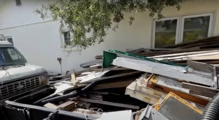 This Florida homeowner has received $75,000 in fines for trash piling up the yard — and neighbors are speaking out