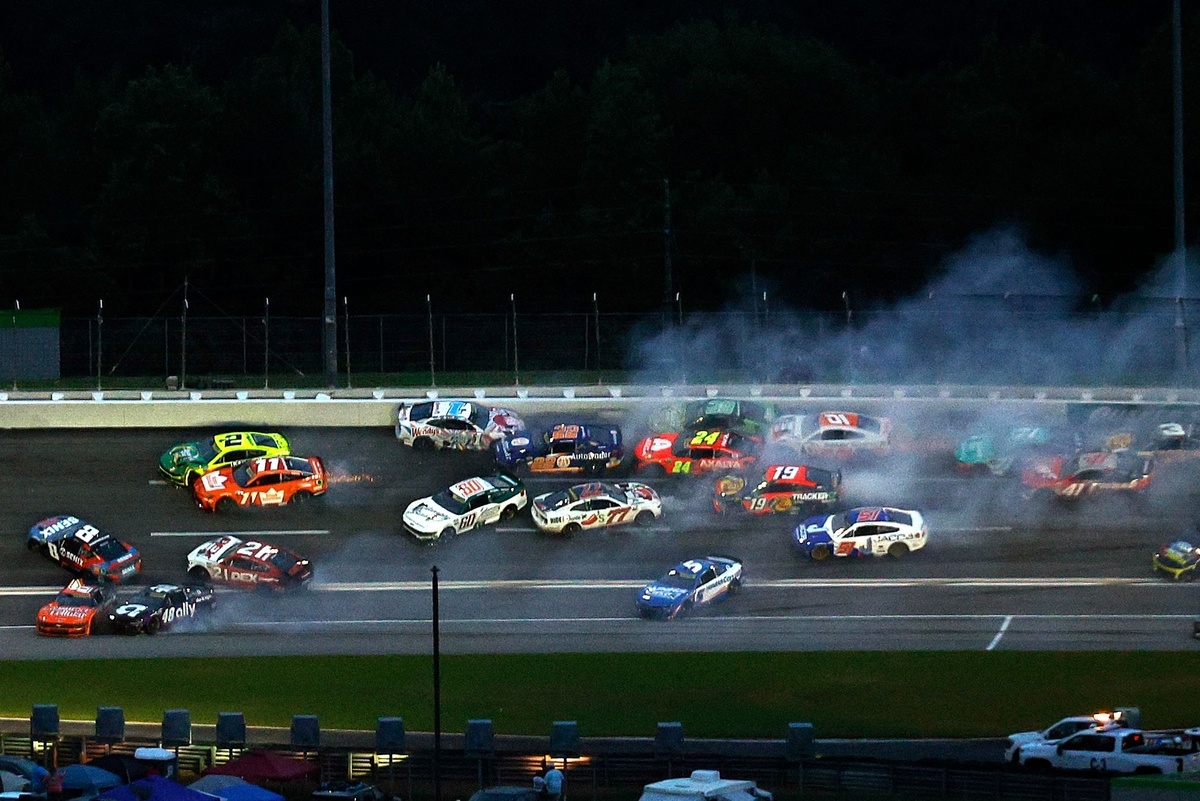 NASCAR halts Atlanta Cup race after huge crash collects half the field