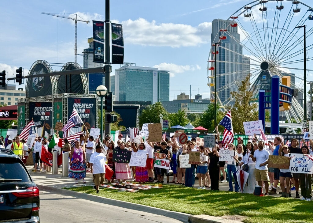 Protesters use CWS as backdrop to decry Trump immigration policies, raids