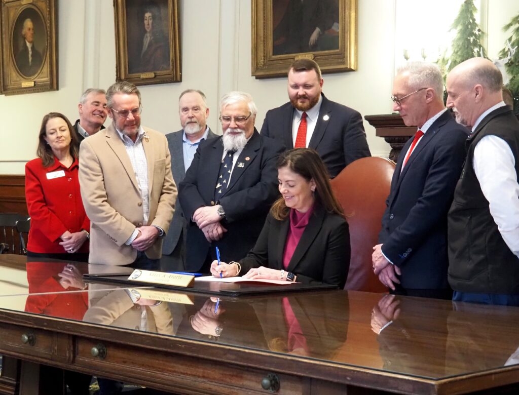 Ayotte signs bill to speed up financing for energy-efficient developments