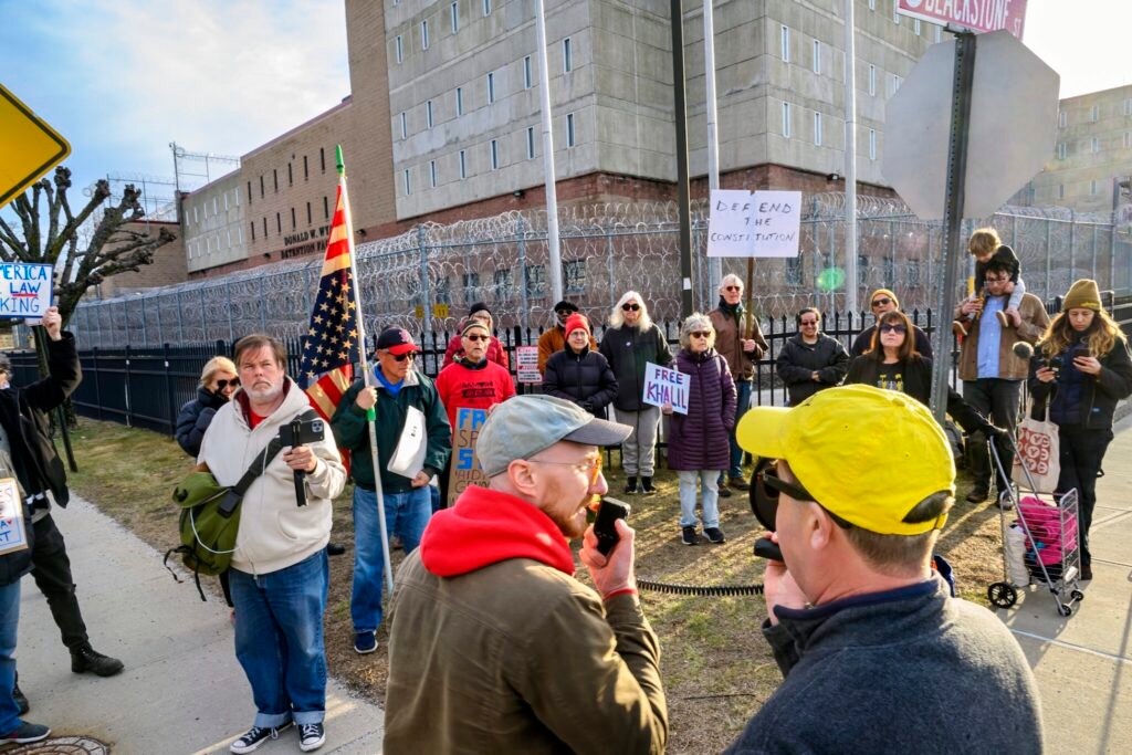 A German-American from Nashua has been jailed for more than a month. It's still unclear why.