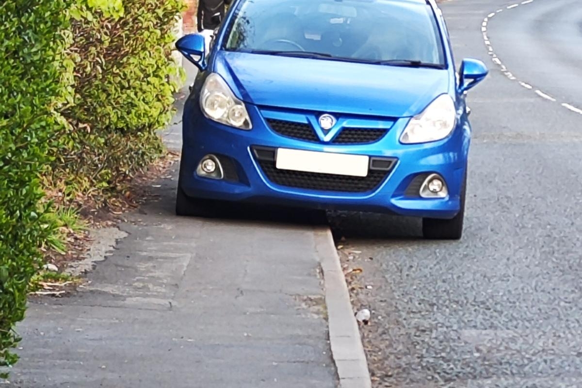 Mobility scooter user forced onto road to avoid 'badly' parked car
