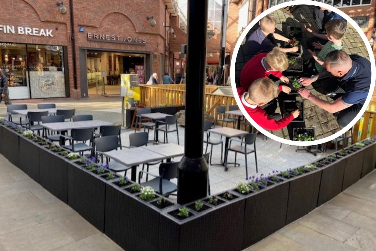 Shopping centre enlists local children to help fill new planters with flowers
