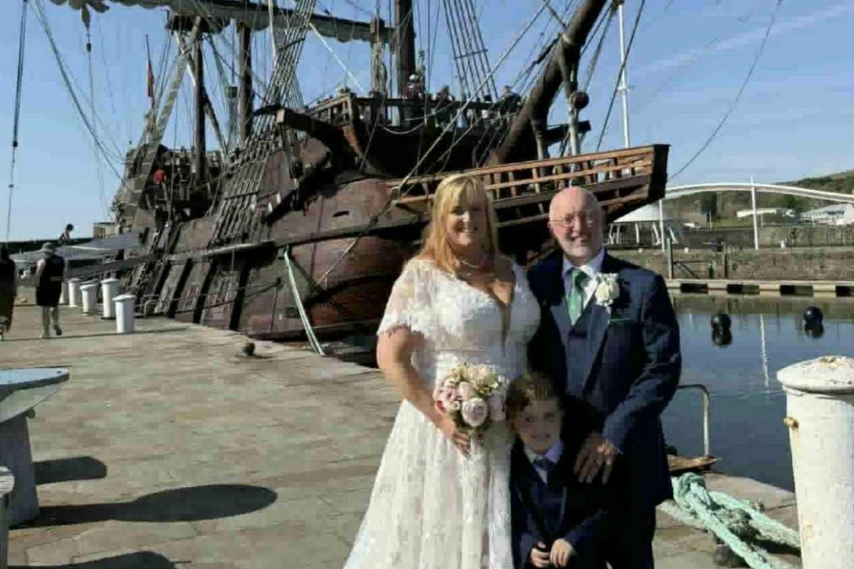 Couple visit tall ship in Whitehaven Harbour on wedding day
