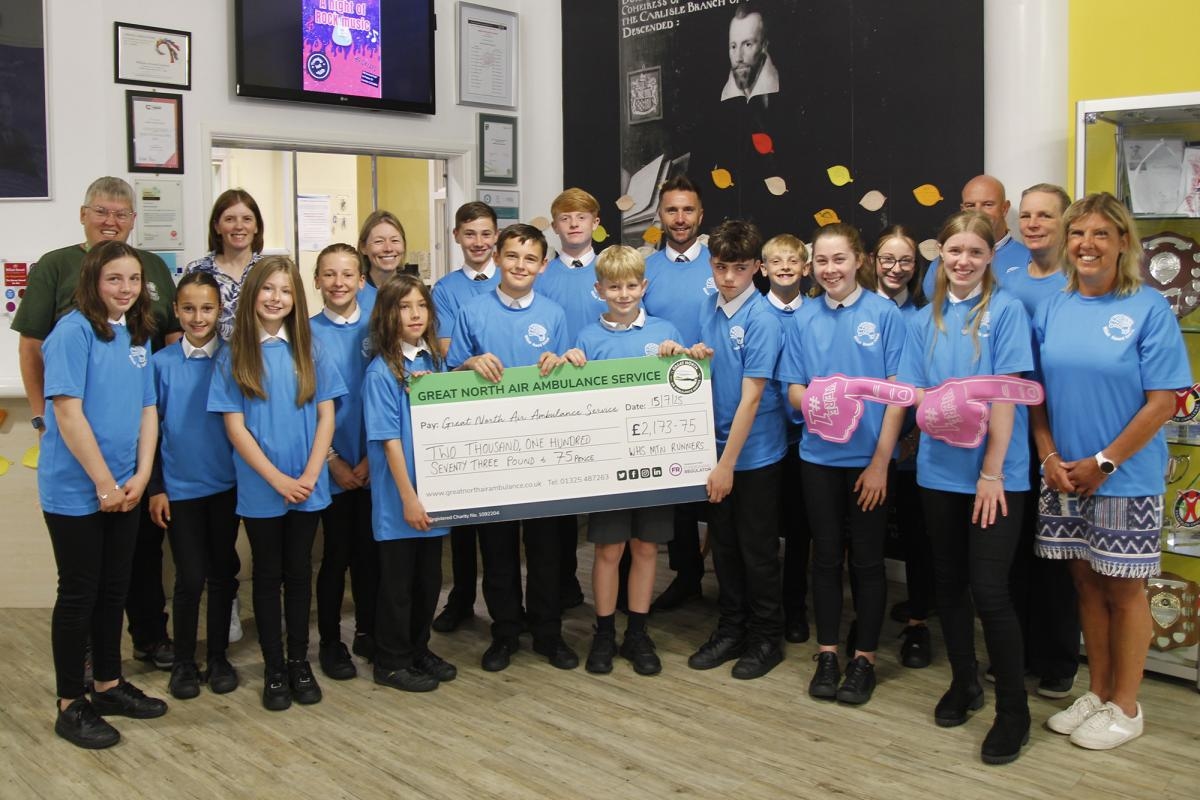 School presents £2,000 cheque to charity after Hadrian's Wall run