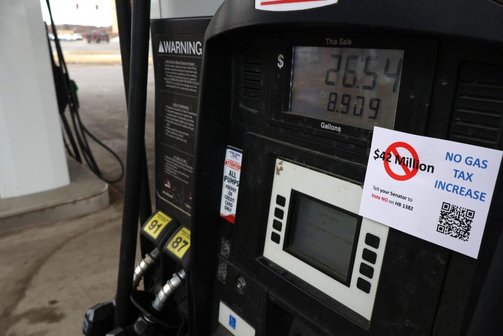 Lawmakers debate 3-cent gas tax increase, hike in EV registration fee