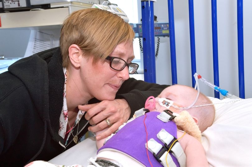 'My baby was born with her heart outside her body - look at her now'