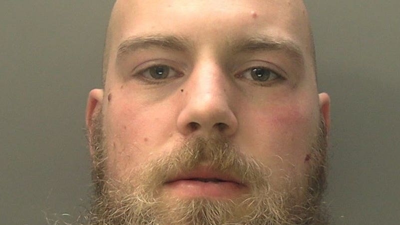 Armed man who attacked officers outside police station jailed for life