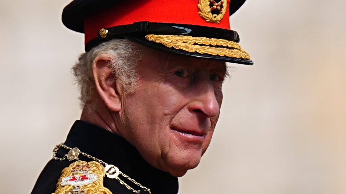 King speaks of ‘global uncertainty' as he presents new standards to regiments