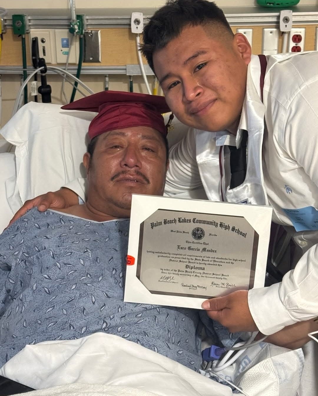 A picture worth a million words: Son, ailing dad celebrate graduation in viral photo
