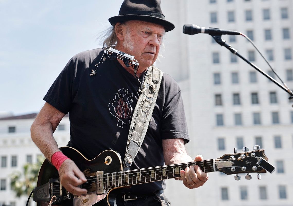 Legendary Guitarist, 79, Stirs Up Controversy with Benefit Concert Performance