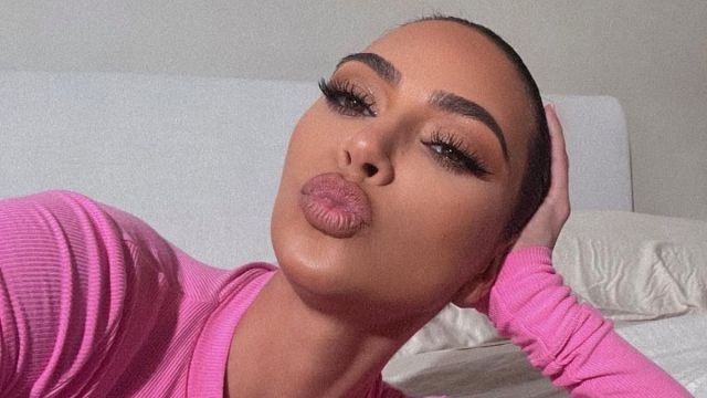Kim Kardashian Goes Braless on a Flight to Korea in New Photos