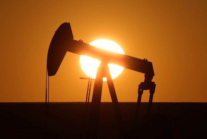 Oil settles flat, pares early losses as tariffs delayed