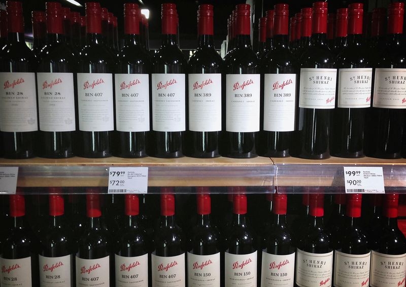 Australia's Treasury Wine drops planned sale of cheaper brands, cuts profit guidance