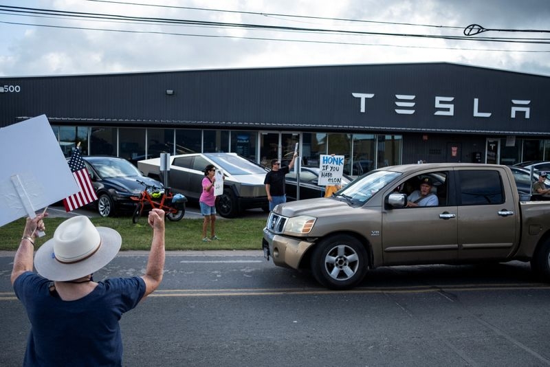 Tesla tiptoes into long-promised robotaxi service