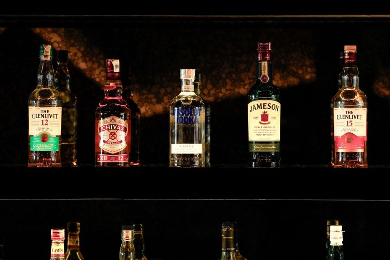 Pernod cuts sales outlook as China's tariffs and weak economy bite