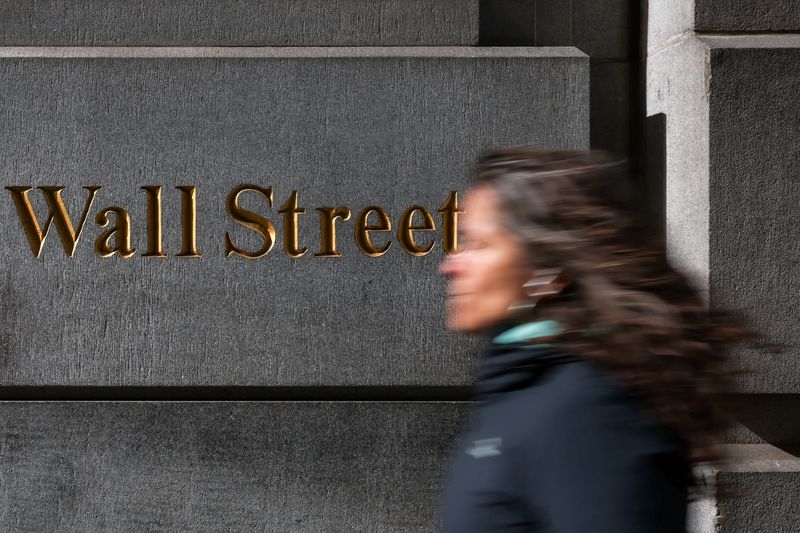 Wall St mixed in start to busy week for earnings, data