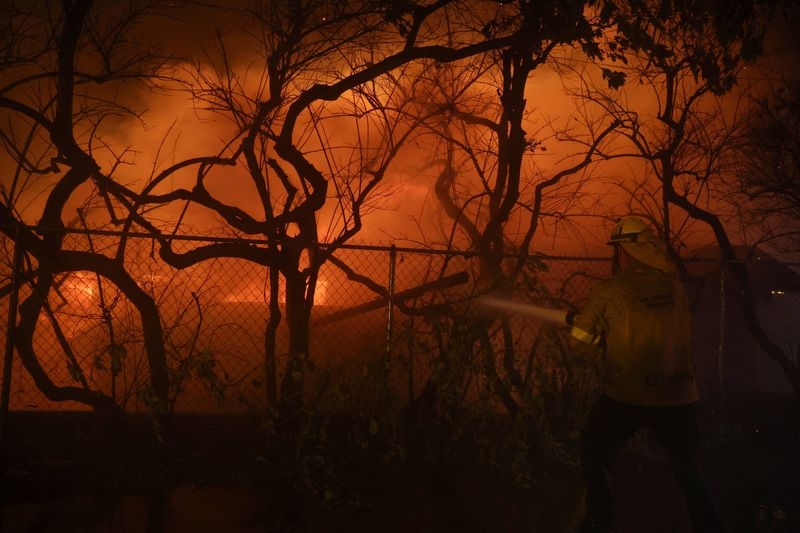 Hartford profit falls as California wildfire losses climb