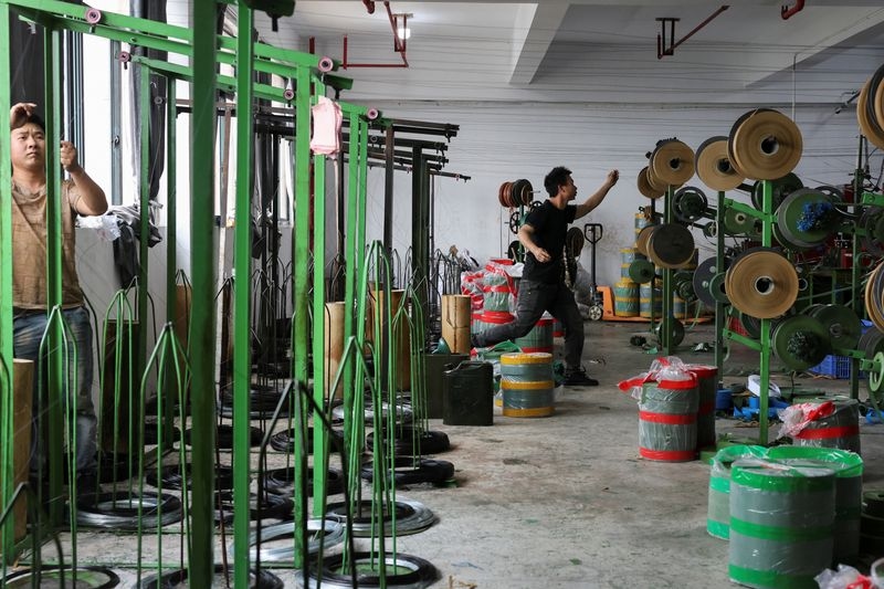 China's factory activity expected to shrink for third month amid trade tensions: Reuters poll
