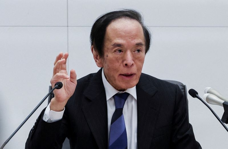 BOJ decides to slow bond taper, keeps rates steady