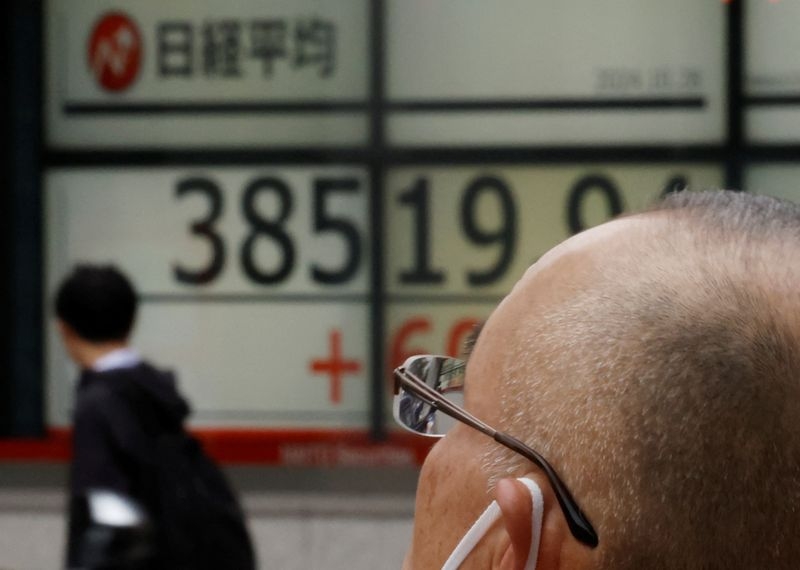 Japanese stocks tumble as banks slump on tariff jitters