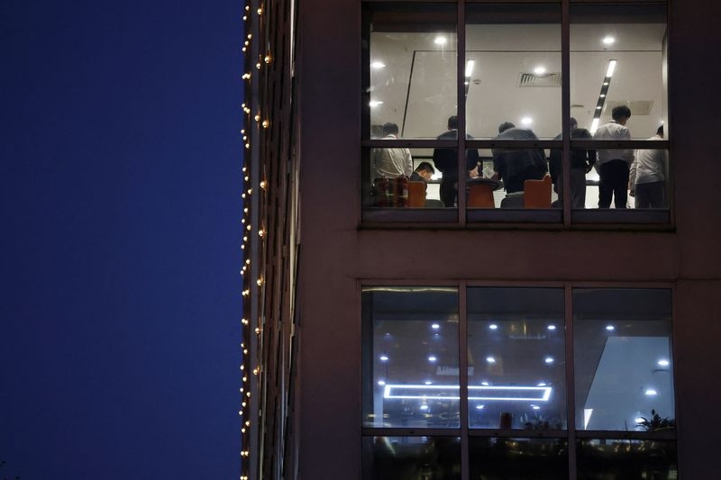 In China, whispers of change as some companies tell staff to work less