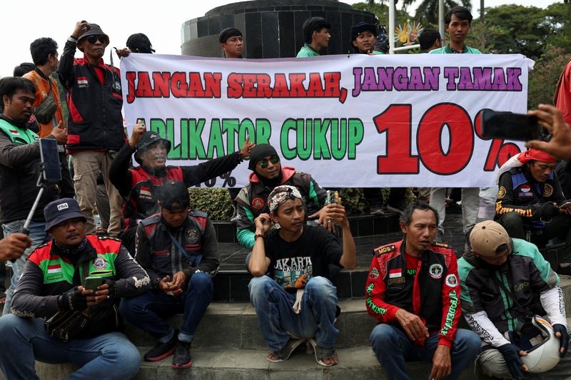Ride-hailing drivers in Indonesia hold protests to demand better pay