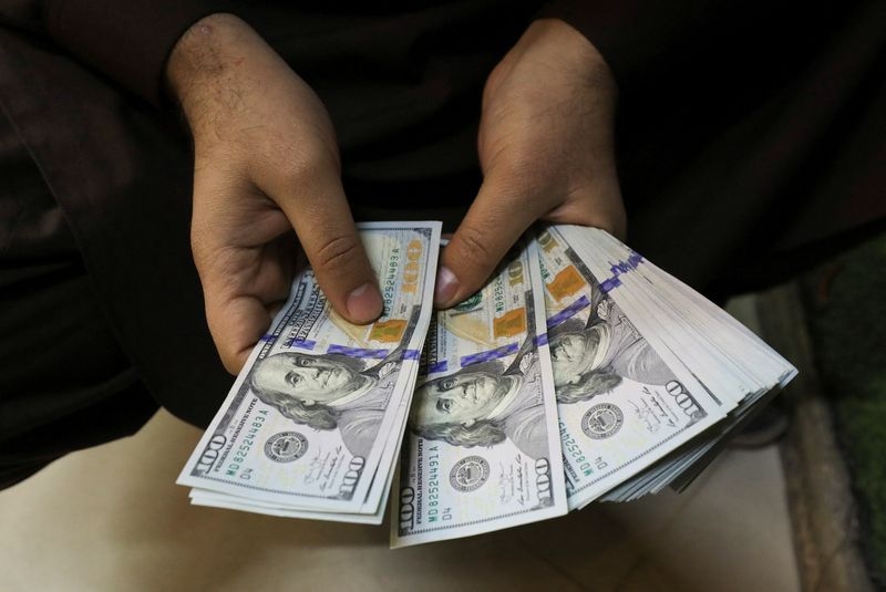 Dollar gains against peers after Fed leaves rates unchanged