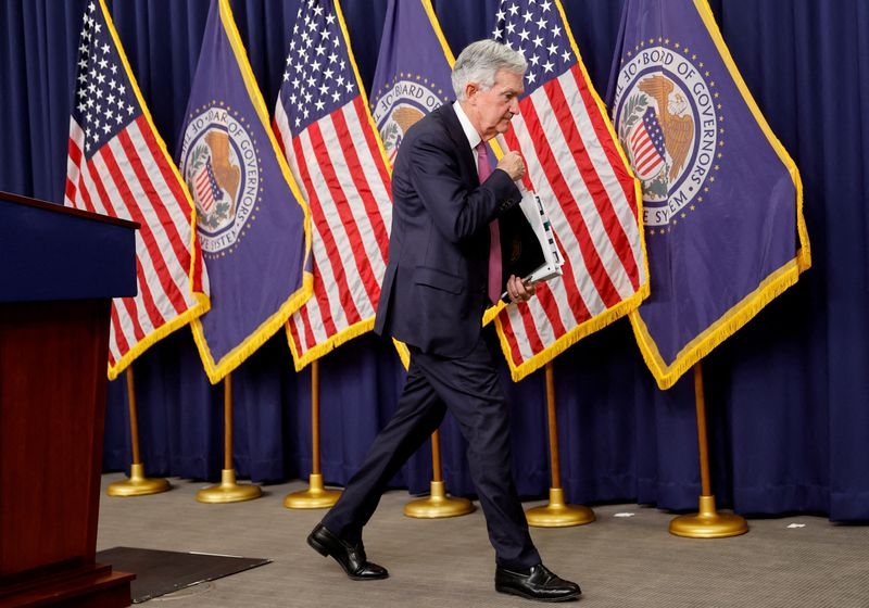 Fed officials see two rate cuts in 2025, but overall turn hawkish