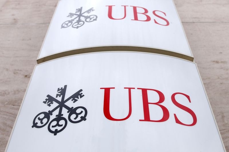 Analysis-Shaken by crises, Switzerland fetters UBS's global dream
