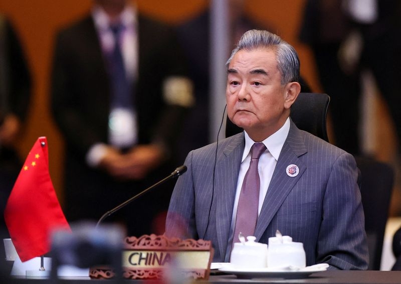 China's foreign minister meets Pakistan army chief, urges protection for nationals