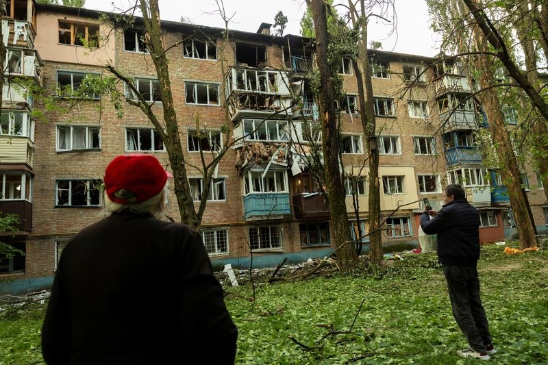 Russian drone fragments set Kyiv apartment building ablaze, official says