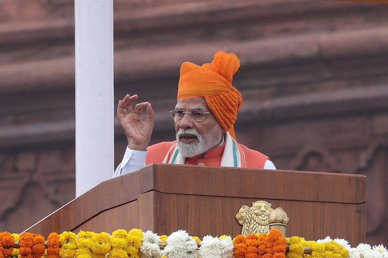 Modi's tax overhaul to strain finances but boost image amid US trade tensions