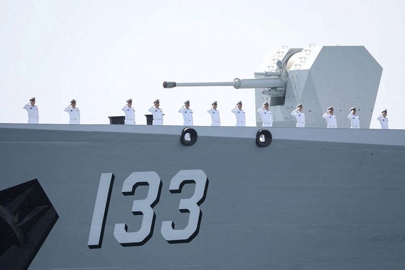 Exclusive-China flexes military muscle with East Asian naval activity, sources say