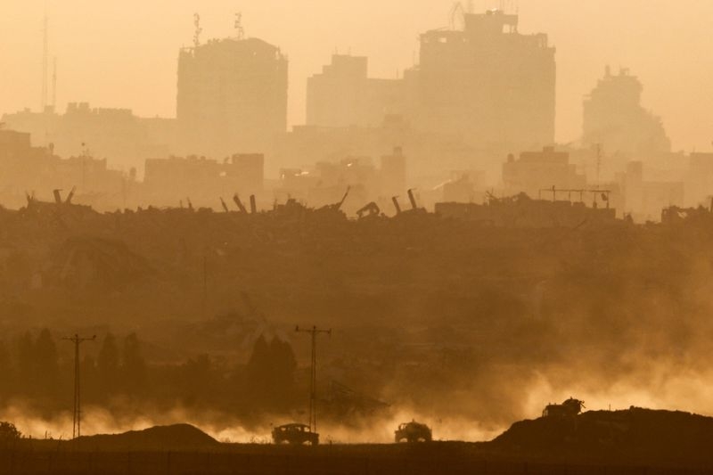Israeli fire kills 23 people in Gaza, many at aid site, medics say