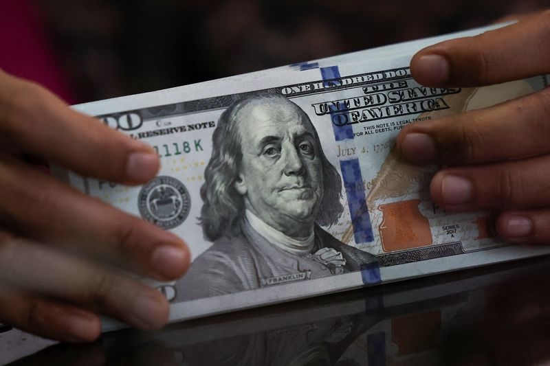 Dollar slips after rally, focus shifts to US-China trade talks