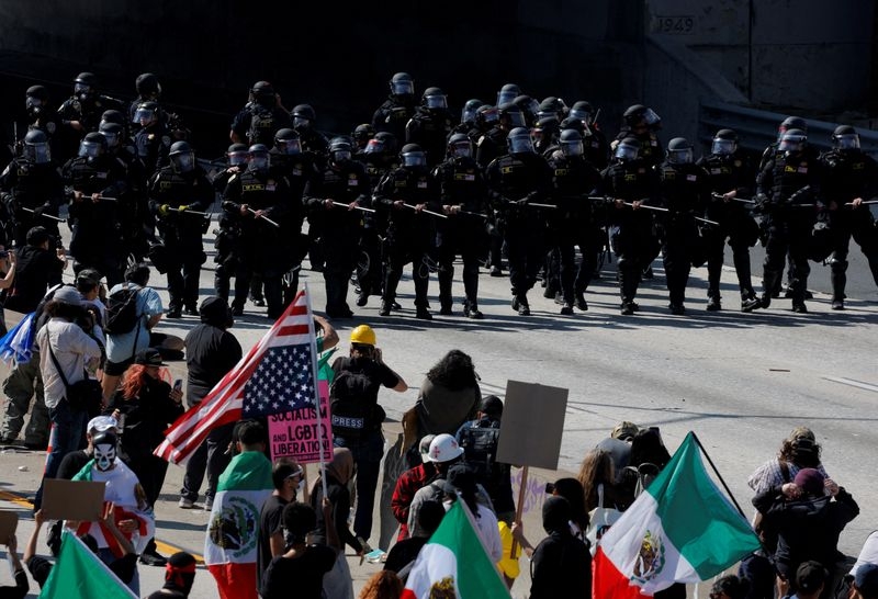 Los Angeles police order immigration protesters in downtown to go home