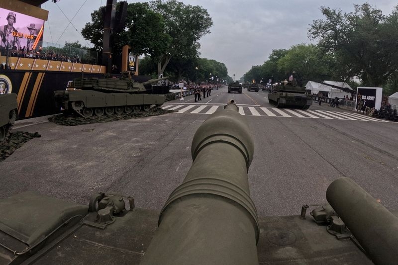 After day of nationwide protests, Trump's military parade rolls through D.C